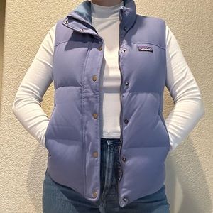 Patagonia women’s puffer vest in size small, in a blue-periwinkle color.